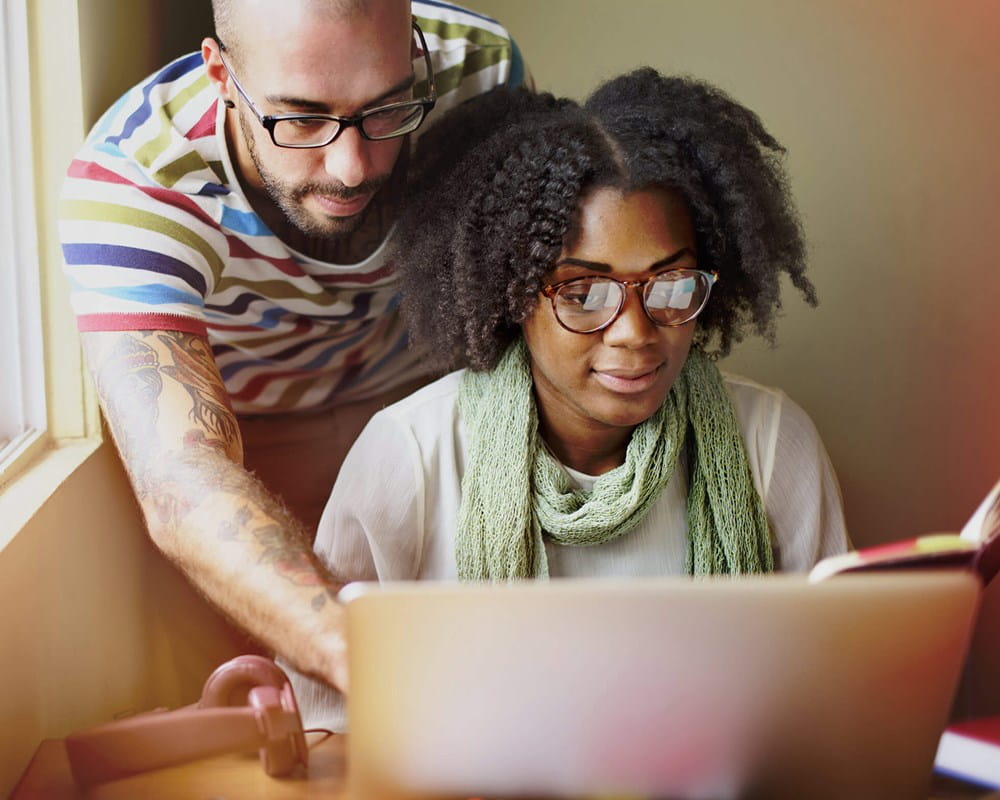 Couple in front of a laptop