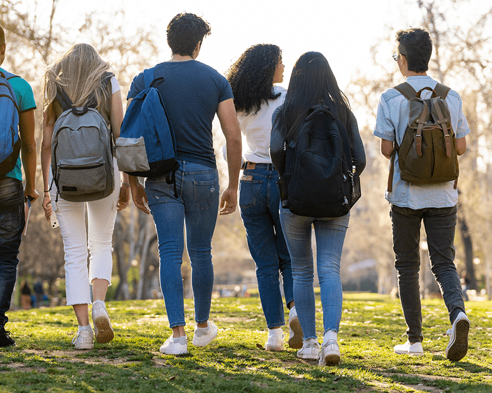 Group of teens walking in park