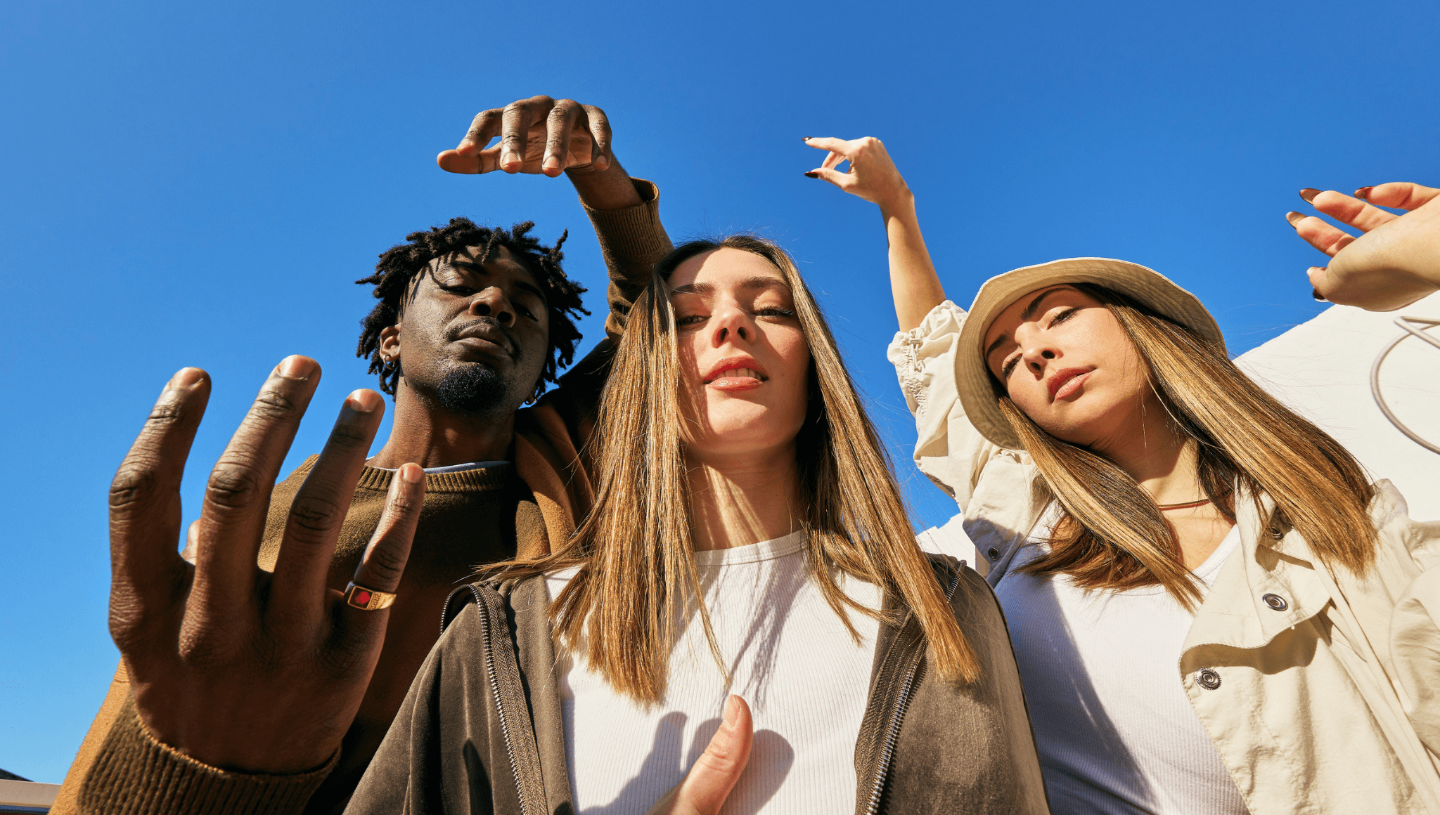 Three people looking at the camera