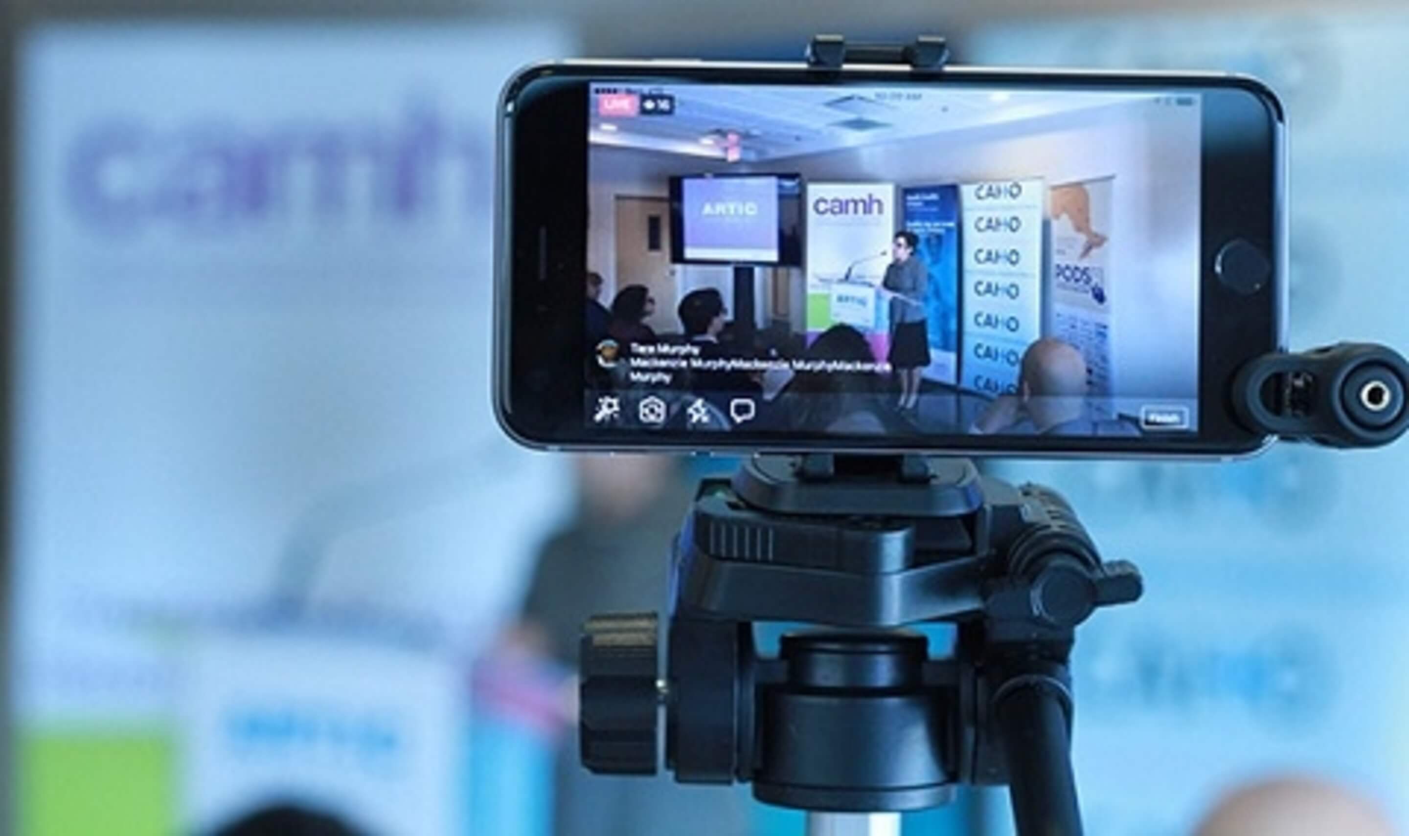 Smartphone being used to film news conference