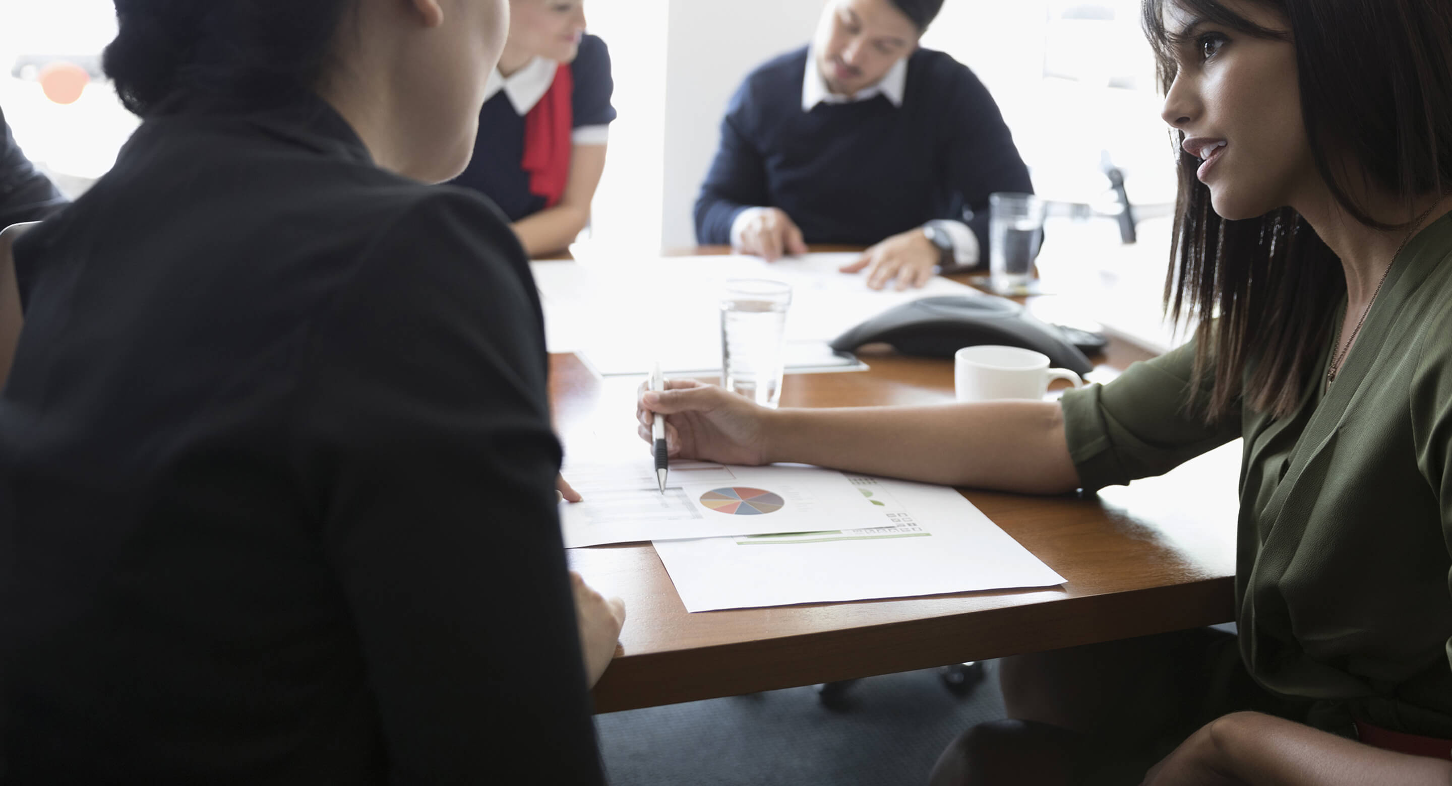 Women reviewing analytics at a meeting