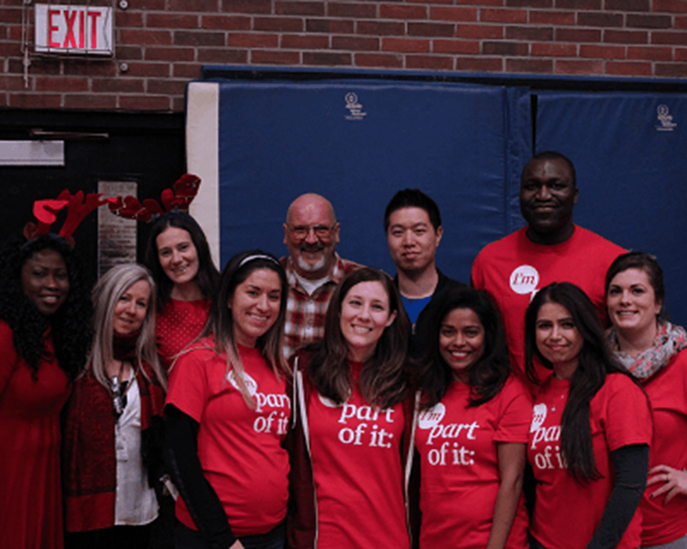 Corporate volunteers from PwC at the Downtown West holiday party. Their t-shirts read: “I’m part of it: empowering communities.”