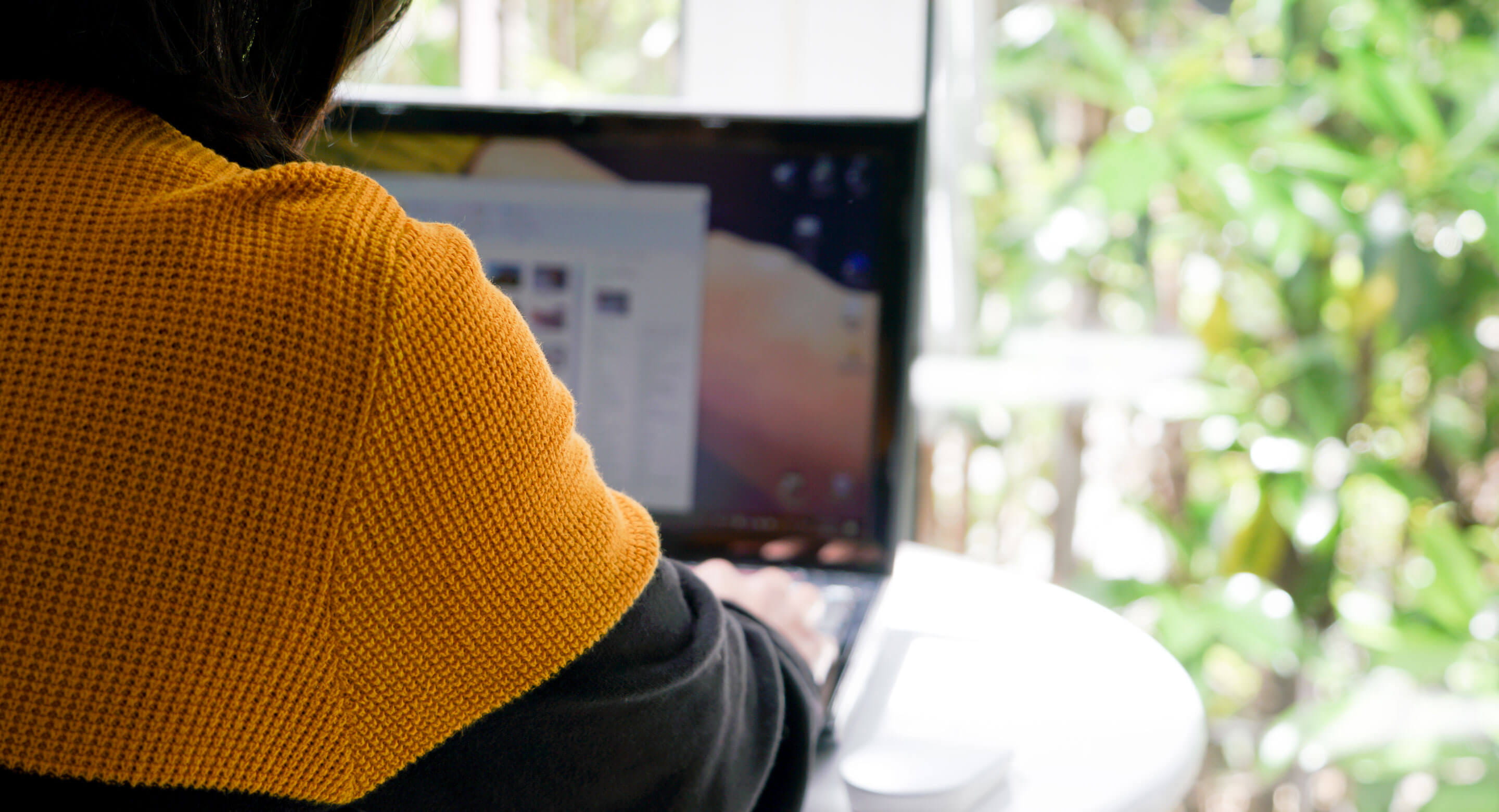 Closeup of someone doing research on a laptop.