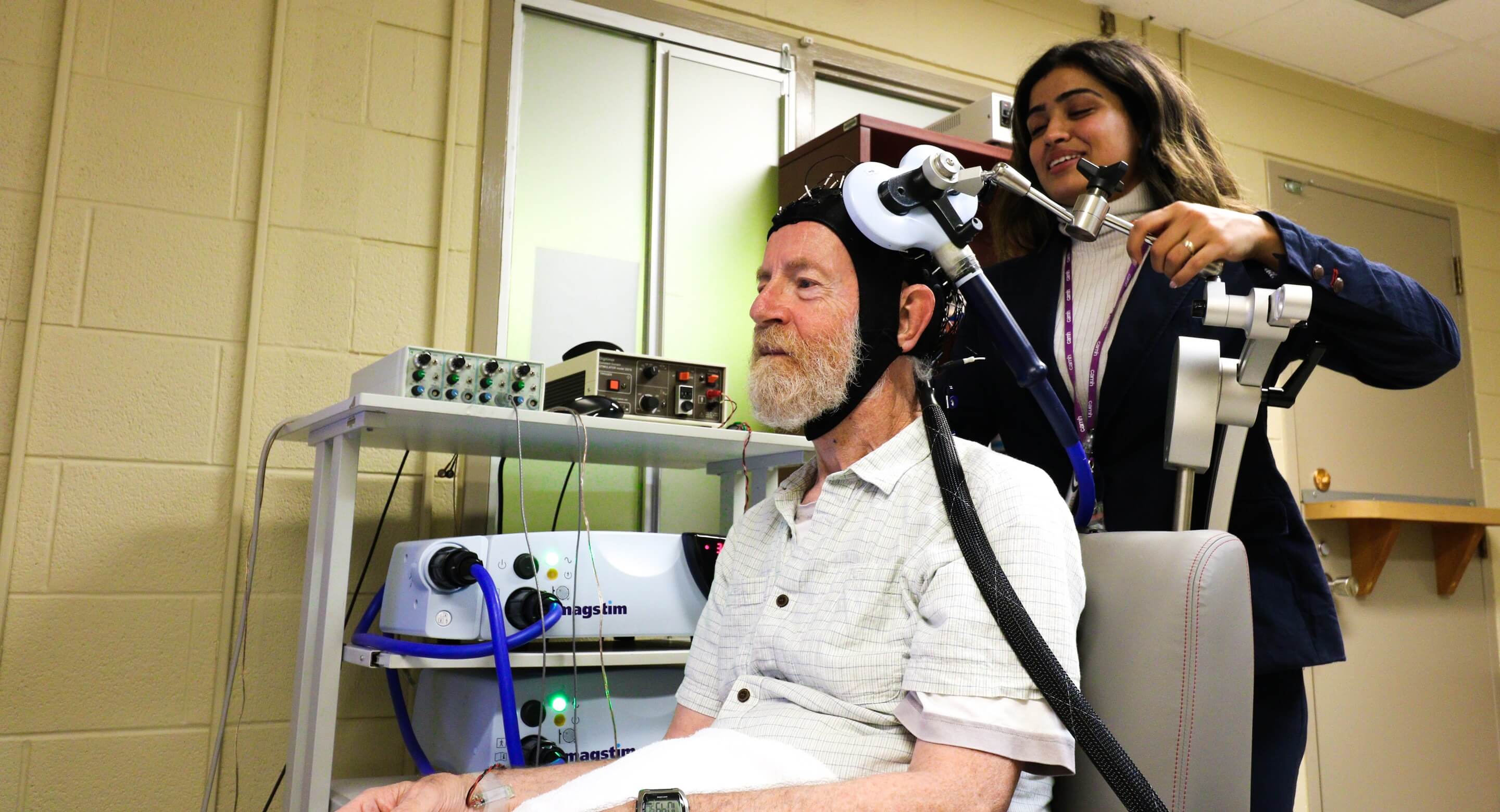 Don Palmer, a research volunteer, and Apoorva Bhandari, Research Analyst in Geriatric Psychiatry at CAMH, demonstrate the innovative, CAMH-developed approach to study brain plasticity in the frontal lobes