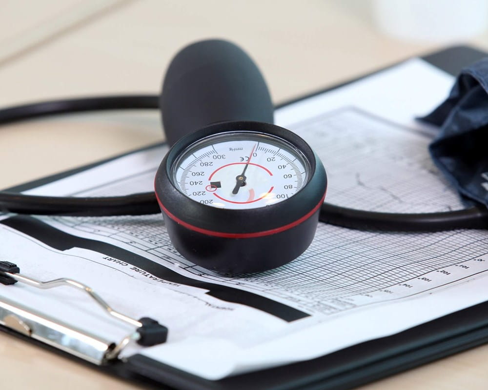 Blood pressure cuff and clipboard on a table