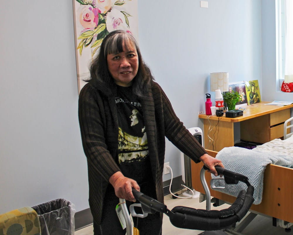 LOFT client Maria in her new room at The Path Home at the College Street site.