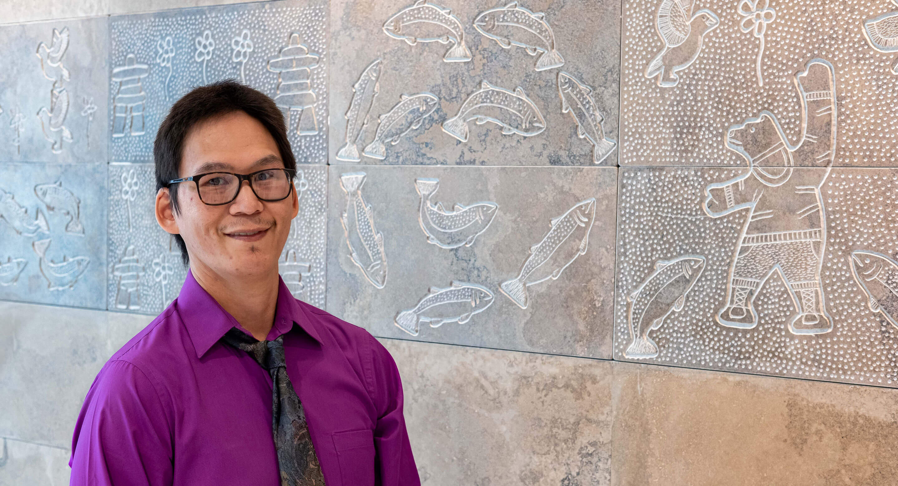 Simon Shimout with mural