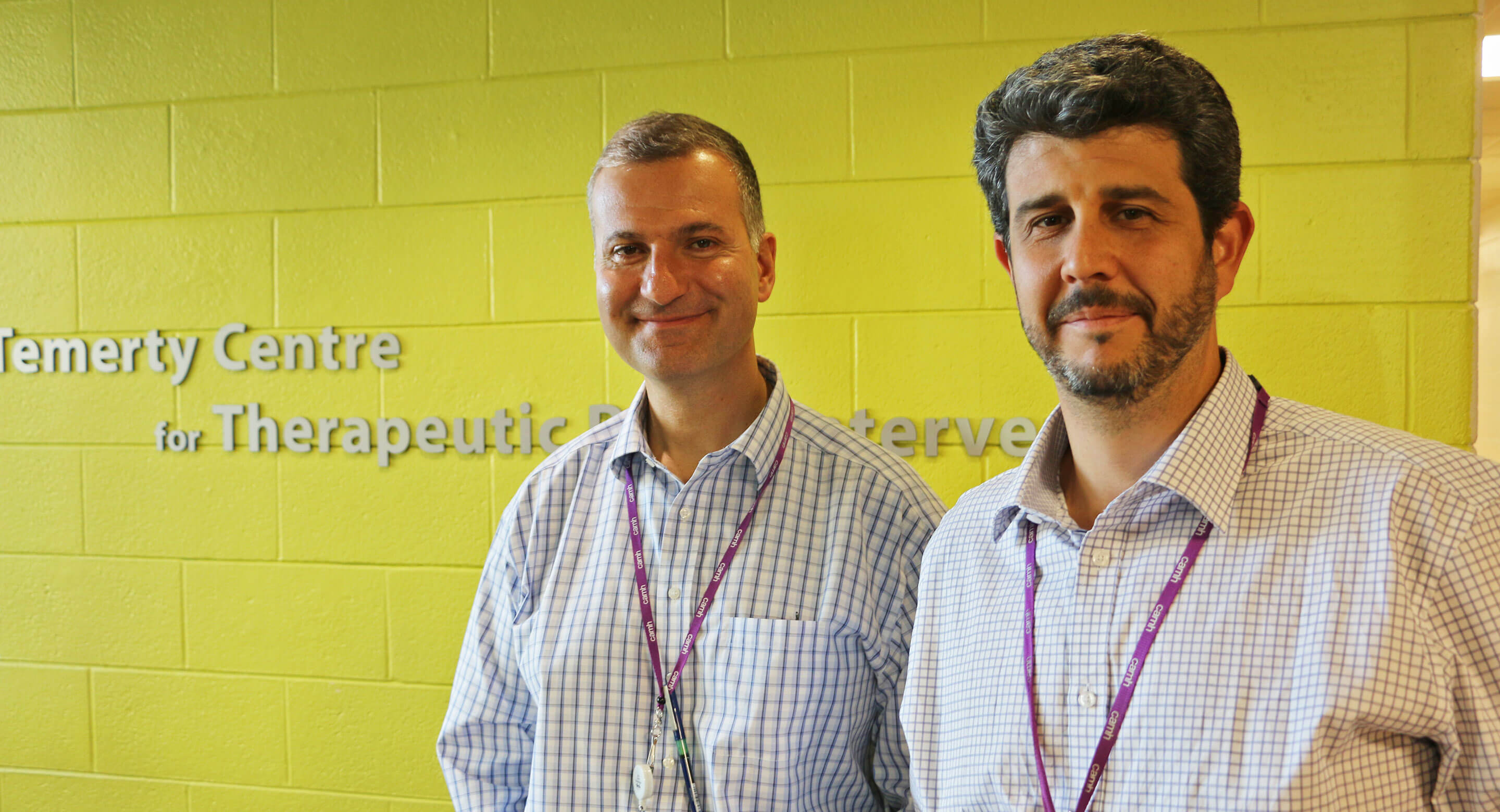 Drs. Jeff Daskalakis and Daniel Blumberger in front of Temerty Centre sign