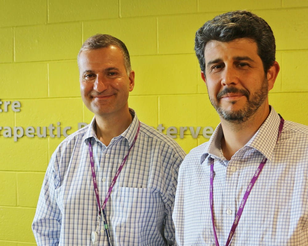 Drs. Jeff Daskalakis and Daniel Blumberger in front of Temerty Centre sign