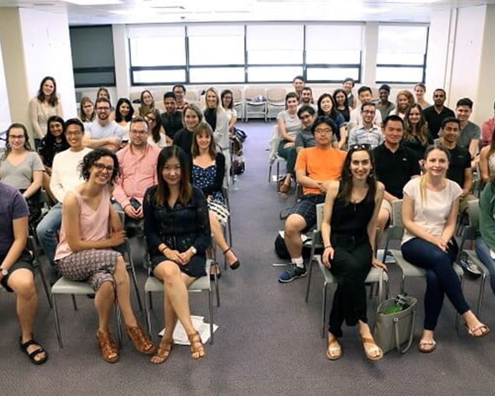 A diverse group of CAMH's newest Psychiatry residents sitting in at an orientation.