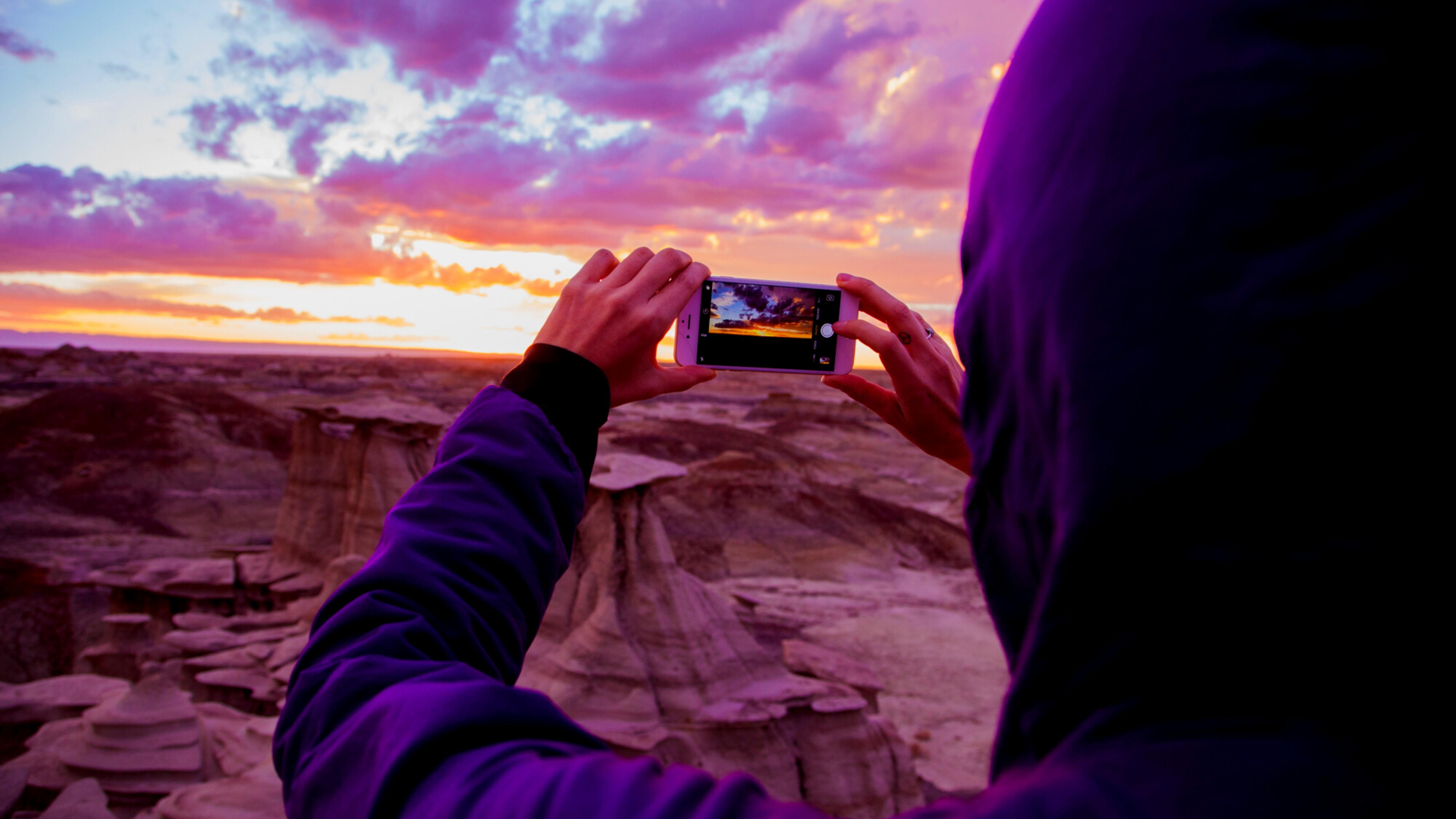 Image of a person taking a photo with a phone