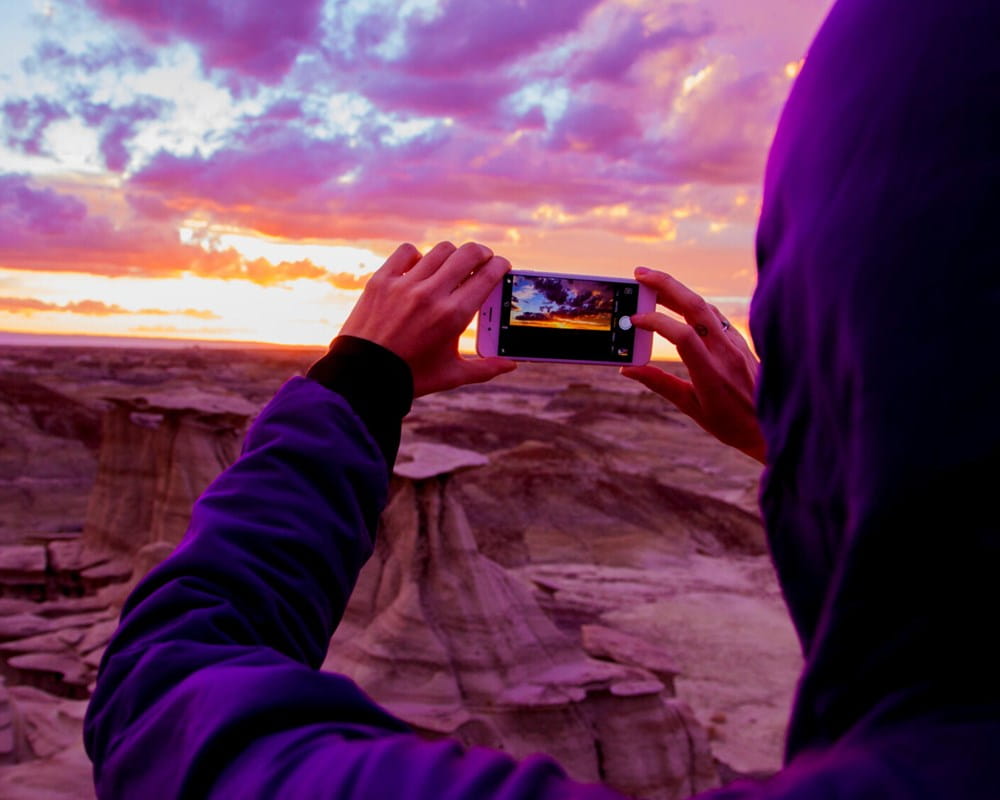 Image of a person taking a photo with a phone