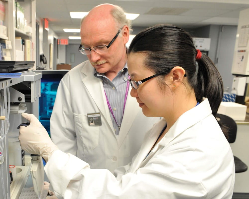 Dr. Jim Kennedy and Dr. Gwyneth Zai in laboratory
