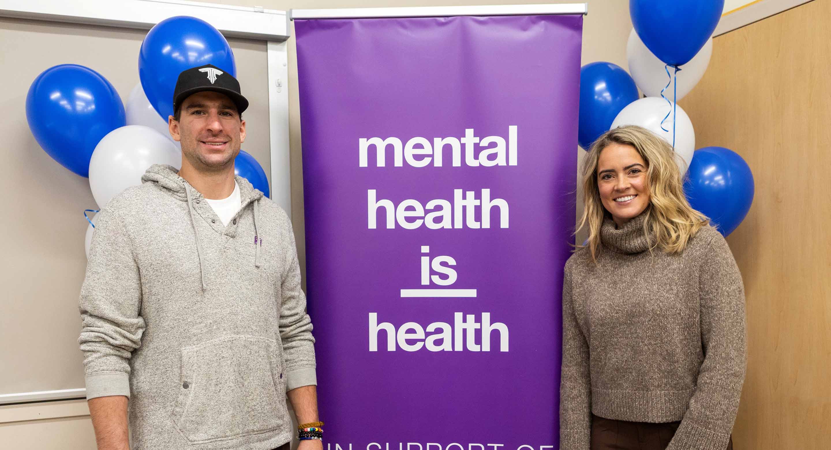 John Tavares next to the Mental Health is Health sign