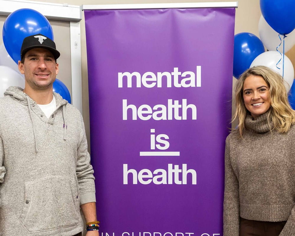 John Tavares next to the Mental Health is Health sign