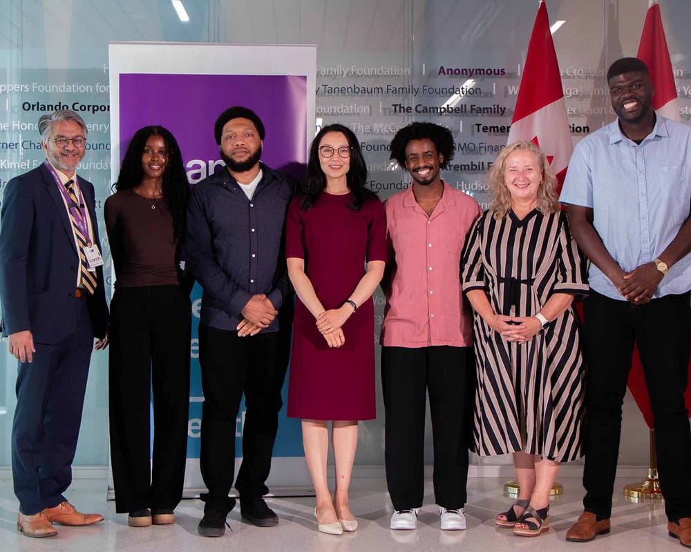 Parliamentary Secretary to the Minister of Health, Maggie Chi with Dr. Peter Selby, CAMH CEO Sarah Downey and members of AMANI and INTREPID Labs staff