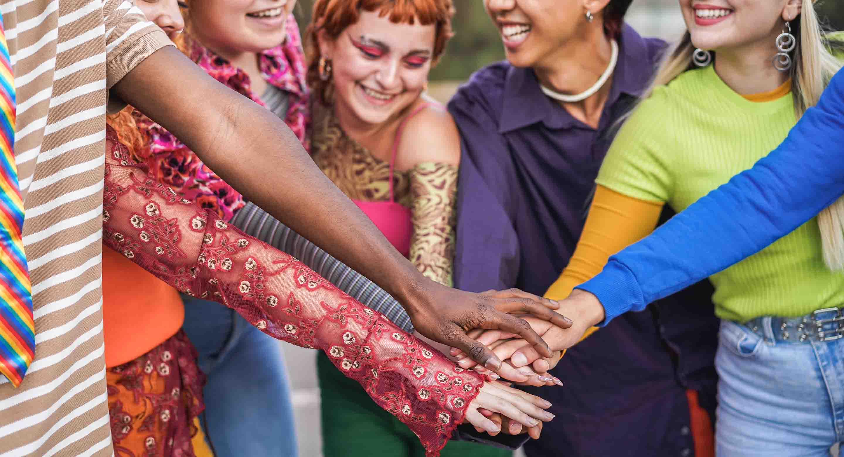 Group of youth putting their hands together